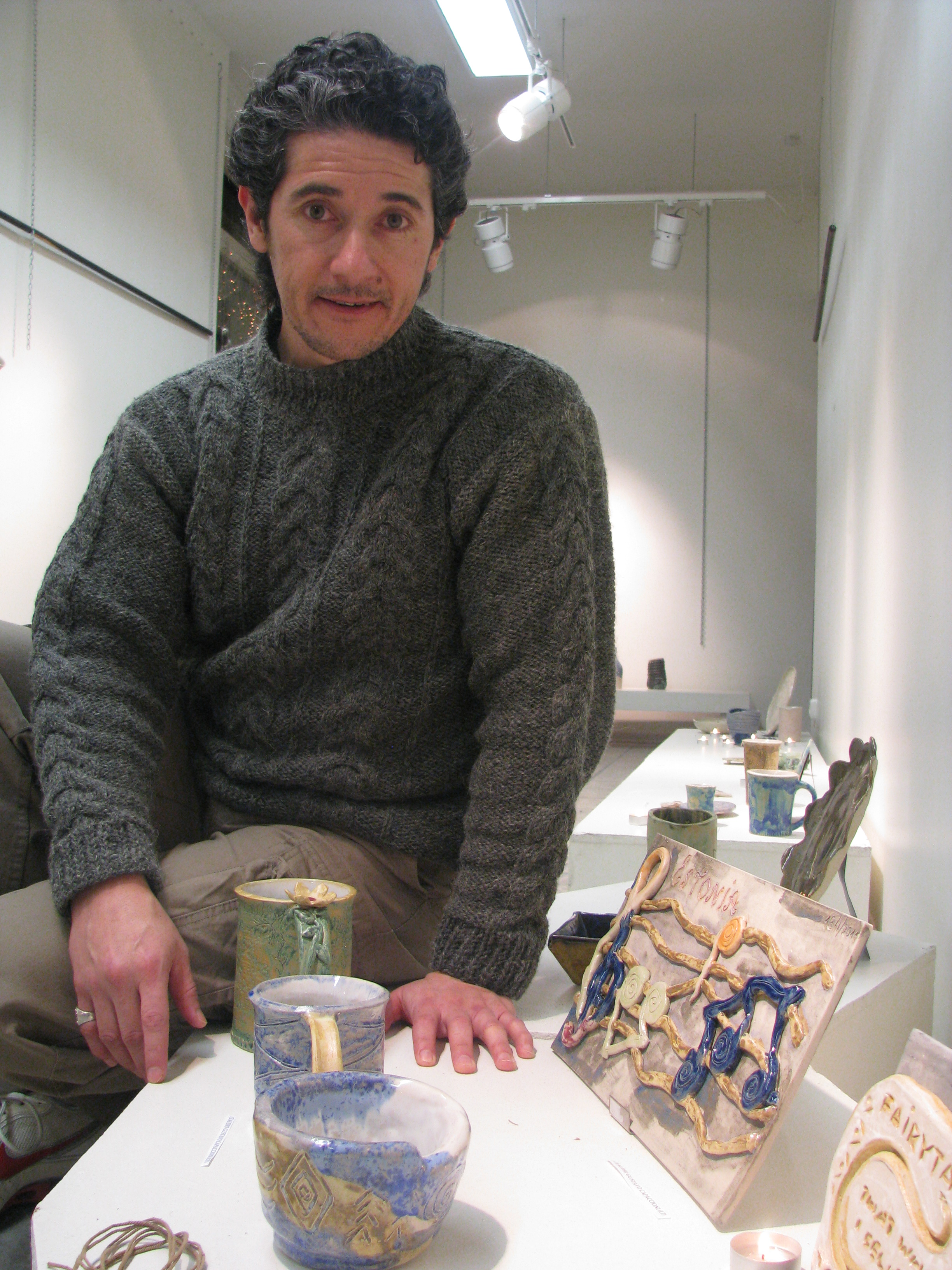 Gustavo with his works